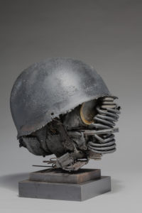 Ronald Gonzalez -  <strong>WAR RELICS # 5</strong> (2018-19<strong style = 'color:#635a27'></strong>)<bR /> Approx. 12 x 11 x 12. Leather, found objects, wire, wax, carbon, screws, and metal filings over welded steel armatures