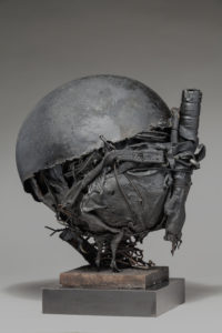 Ronald Gonzalez -  <strong>WAR RELICS # 7</strong> (2018-19<strong style = 'color:#635a27'></strong>)<bR /> Approx. 12 x 11 x 12. Leather, found objects, wire, wax, carbon, screws, and metal filings over welded steel armatures