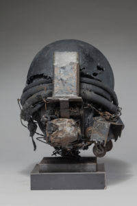 Ronald Gonzalez -  <strong>WAR RELICS # 8</strong> (2018-19<strong style = 'color:#635a27'></strong>)<bR /> Approx. 12 x 11 x 12. Leather, found objects, wire, wax, carbon, screws, and metal filings over welded steel armatures