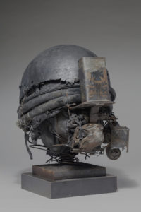 Ronald Gonzalez -  <strong>WAR RELICS # 8</strong> (2018-19<strong style = 'color:#635a27'></strong>)<bR /> Approx. 12 x 11 x 12. Leather, found objects, wire, wax, carbon, screws, and metal filings over welded steel armatures