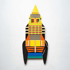 Kumkum Fernando -  <strong>Temple Rocket,</strong> (2024<strong style = 'color:#635a27'></strong>)<bR /> Mixed media — up-cycled wooden frame 
and stainless steel, brass embellishments,
H40 x W17 x D3